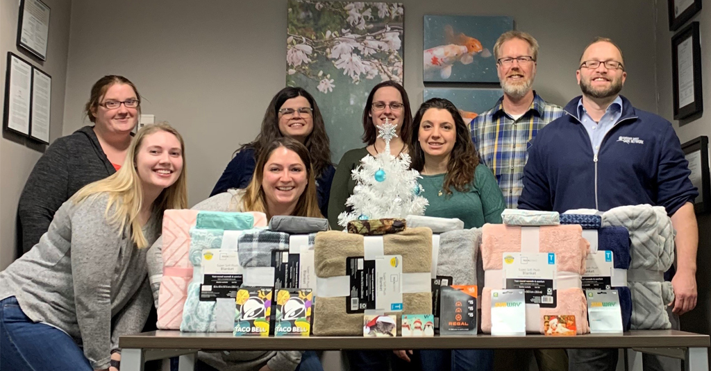 The Anchorage team with donations for the Anchorage School District’s Child in Transition Program